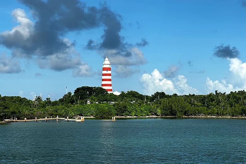 Abacos — the candy-striped Hope Town lighthouse on Elbow Cay seen from the water