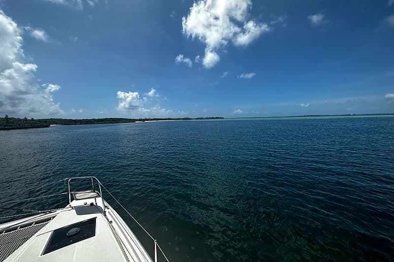 Approaching a new anchorage in the Abacos — cays low on the horizon