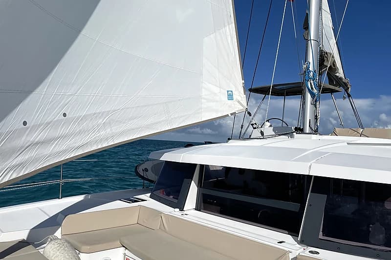 Under full sail between Exumas cays, mainsail and genoa drawing